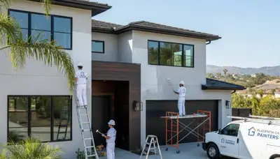 Professional house painters finishing exterior home in Anaheim, CA