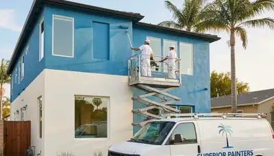 Professional house painters finishing exterior home in Anaheim, CA
